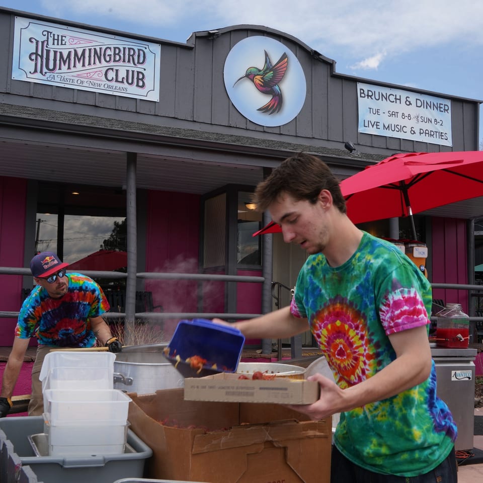 The Hummingbird Club team preparing food for a community event